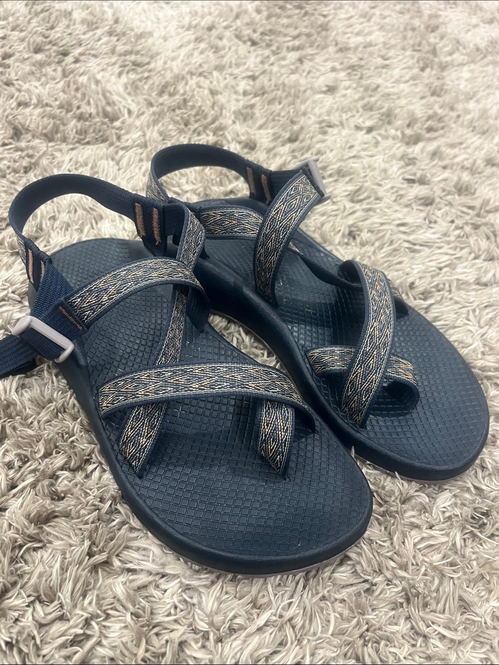 Chaco navy sandals with woven tan-accented straps.  VERY GENTLY WORN